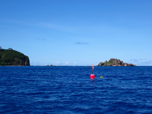The first Southern “Backyard Buoy” is deployed in Hågat with Facpi Island visible in the background. (Photo by the Guam Coastal Management Program).