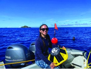Camille Quichocho, Biologist with the Guam Coastal Management Program, prepares to launch the first Southern Backyard Buoy off the coast of Hågat. (Photo by the Guam Coastal Management Program).